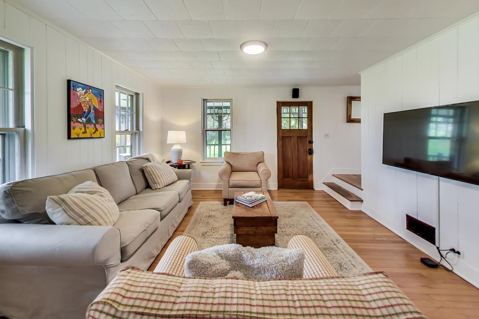 20792 Illinois Rte 59 Barrington, IL 60010 - Photo 5 of 35 a living room with furniture and a flat screen tv
