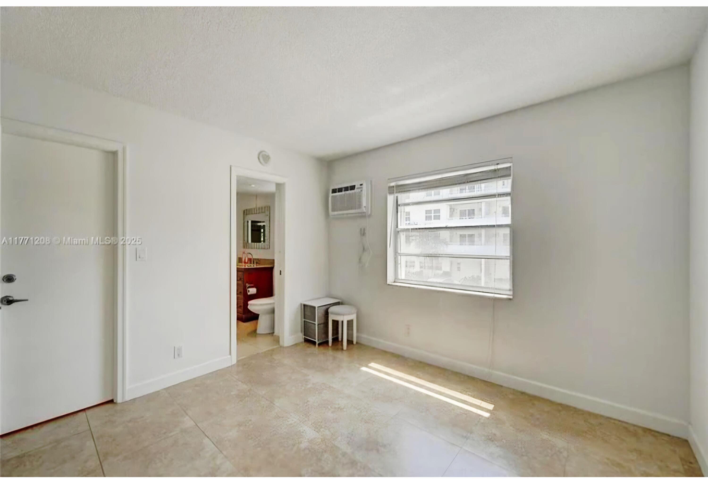 200 South Birch Road, Unit 208 Fort Lauderdale, FL 33316 - Photo 14 of 22 an empty room with windows