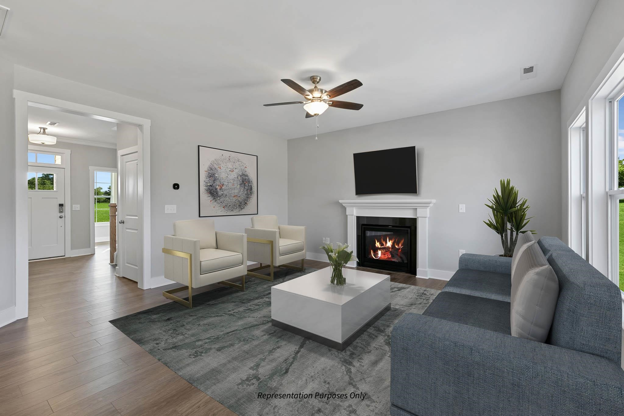 142 Beacon Hl Road Lillington, NC 27546 - Photo 11 of 38 a living room with furniture a fireplace and a flat screen tv