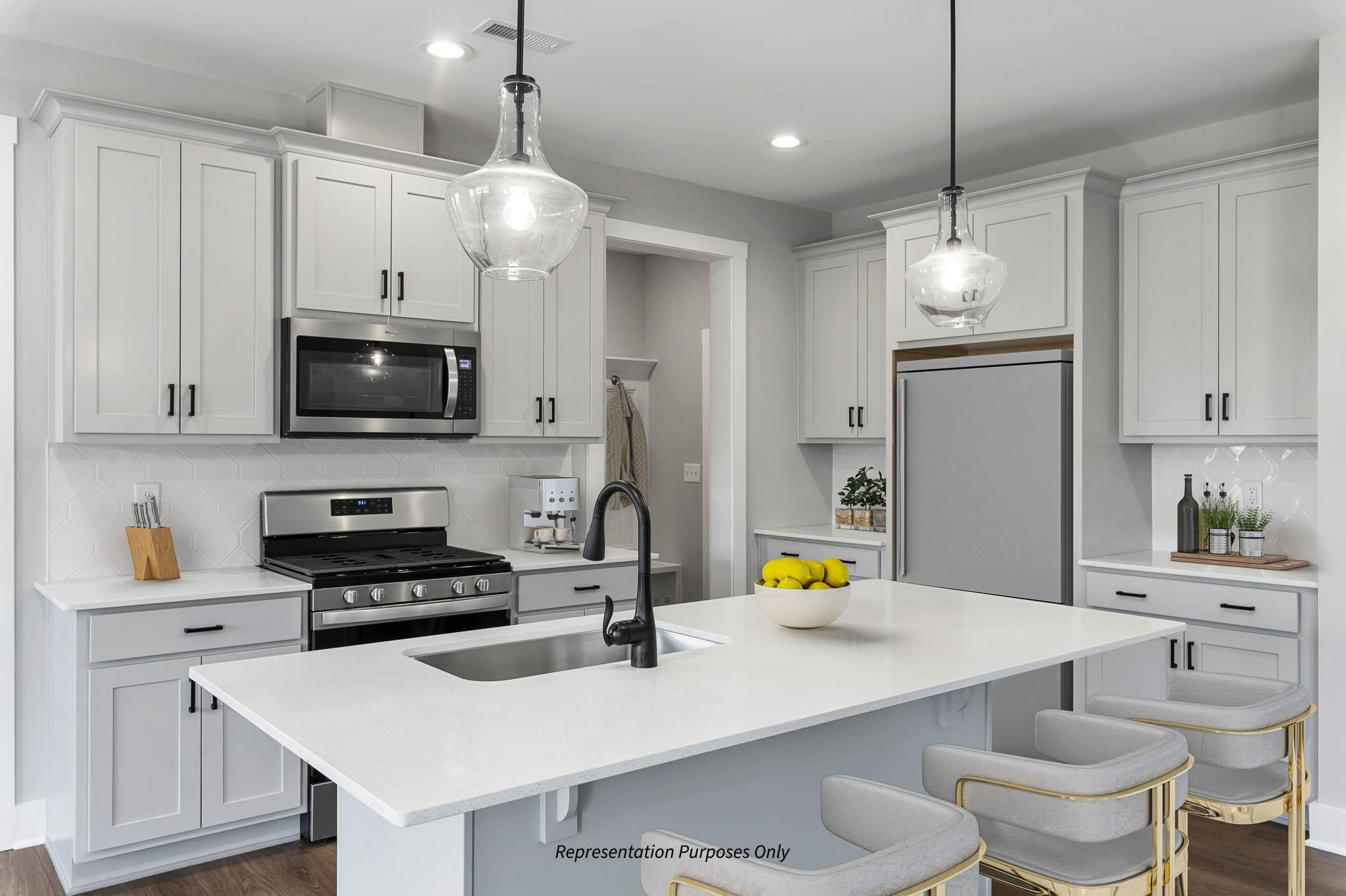 142 Beacon Hl Road Lillington, NC 27546 - Photo 14 of 38 a kitchen with a sink a stove and chairs
