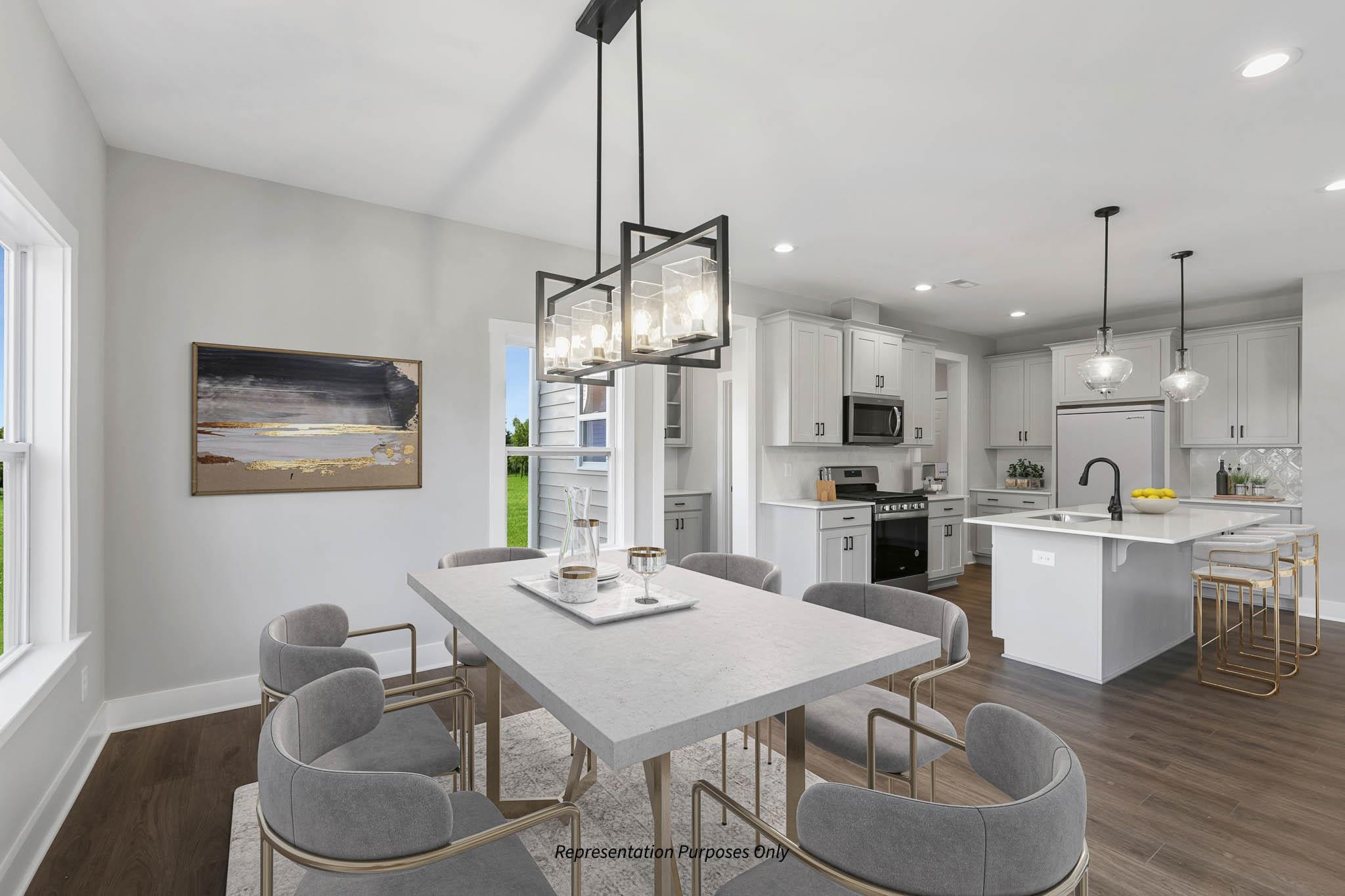 142 Beacon Hl Road Lillington, NC 27546 - Photo 19 of 38 a kitchen with stainless steel appliances kitchen island granite countertop a table chairs and a living room view