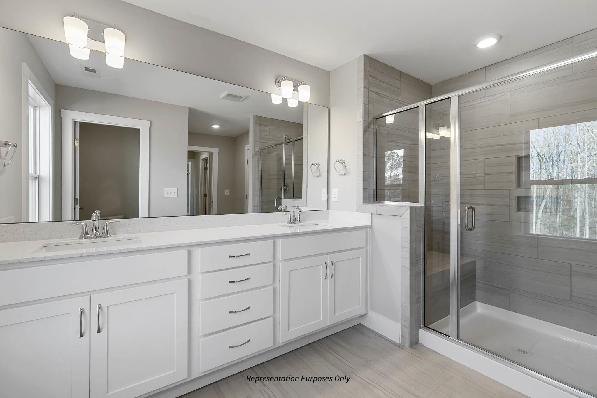 142 Beacon Hl Road Lillington, NC 27546 - Photo 24 of 38 a bathroom with double sink and a mirror