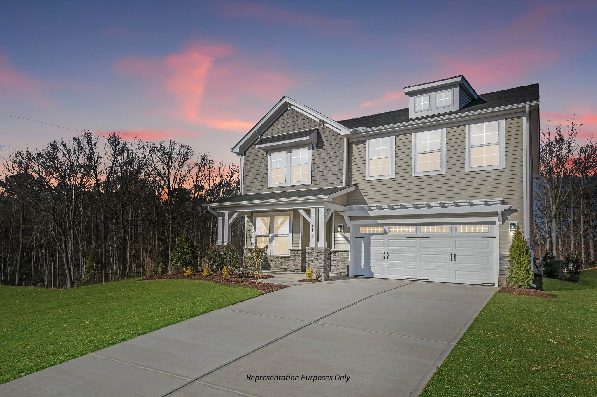 142 Beacon Hl Road Lillington, NC 27546 - Photo 4 of 38 a front view of a house with a yard and garage