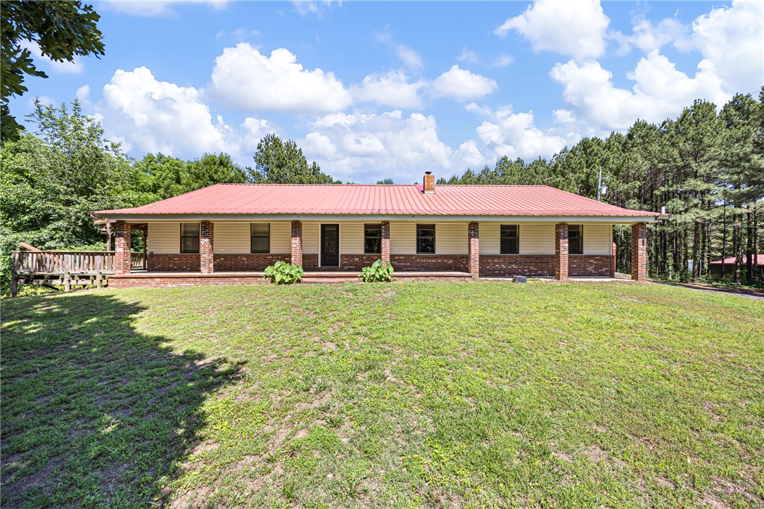 655 Charton Road Morrilton, AR 72110 - Photo 1 of 49 Single-story residence featuring a red metal roof and brick and siding exterior