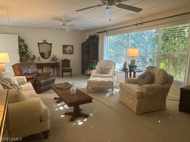 1261 Pine Ridge Road Naples, FL 34108 - Photo 7 of 13 Carpeted living area featuring ceiling fan