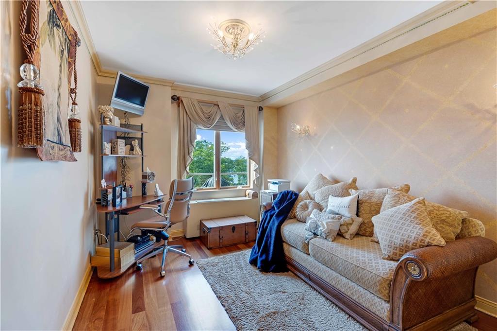 9935 Shore Road, Unit 6B Brooklyn, NY 11209 - Photo 8 of 9 a living room with furniture and a wooden floor