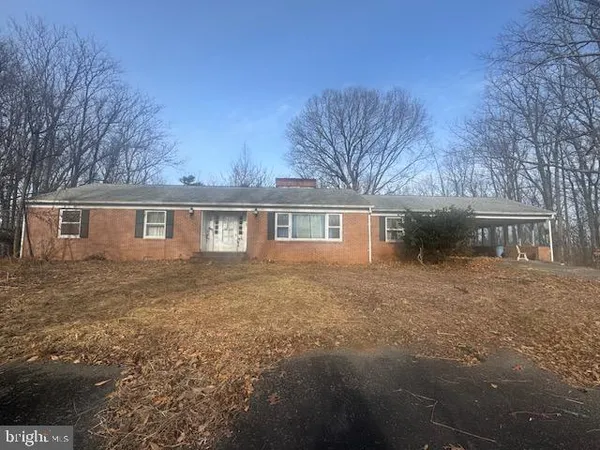 a front view of a house with yard