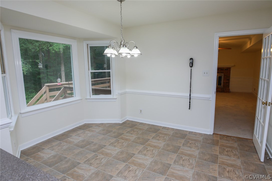 3003 Cove Ridge Road Midlothian, VA 23112 - Photo 11 of 33 a view of a big room with windows and chandelier
