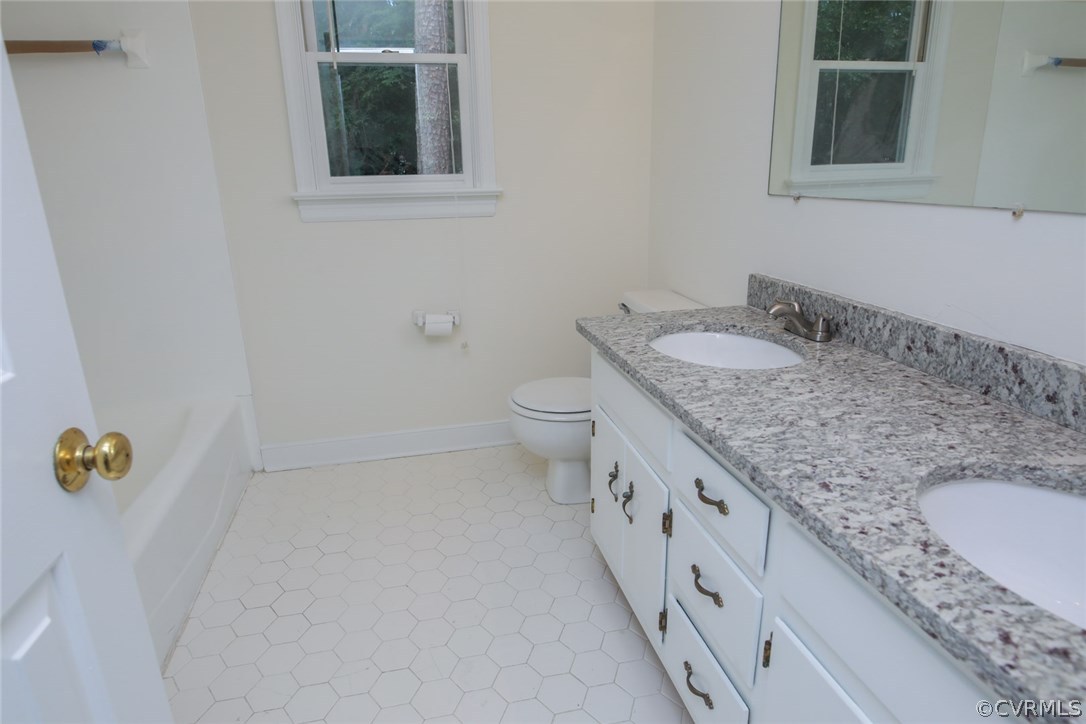 3003 Cove Ridge Road Midlothian, VA 23112 - Photo 16 of 33 a bathroom with a granite countertop sink and a mirror