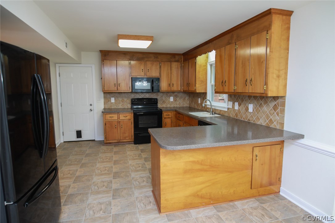 3003 Cove Ridge Road Midlothian, VA 23112 - Photo 6 of 33 a kitchen with stainless steel appliances granite countertop a sink stove and refrigerator