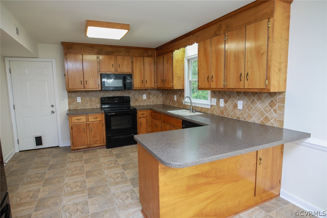 3003 Cove Ridge Road Midlothian, VA 23112 - Photo 7 of 33 a kitchen with stainless steel appliances granite countertop a sink stove and refrigerator