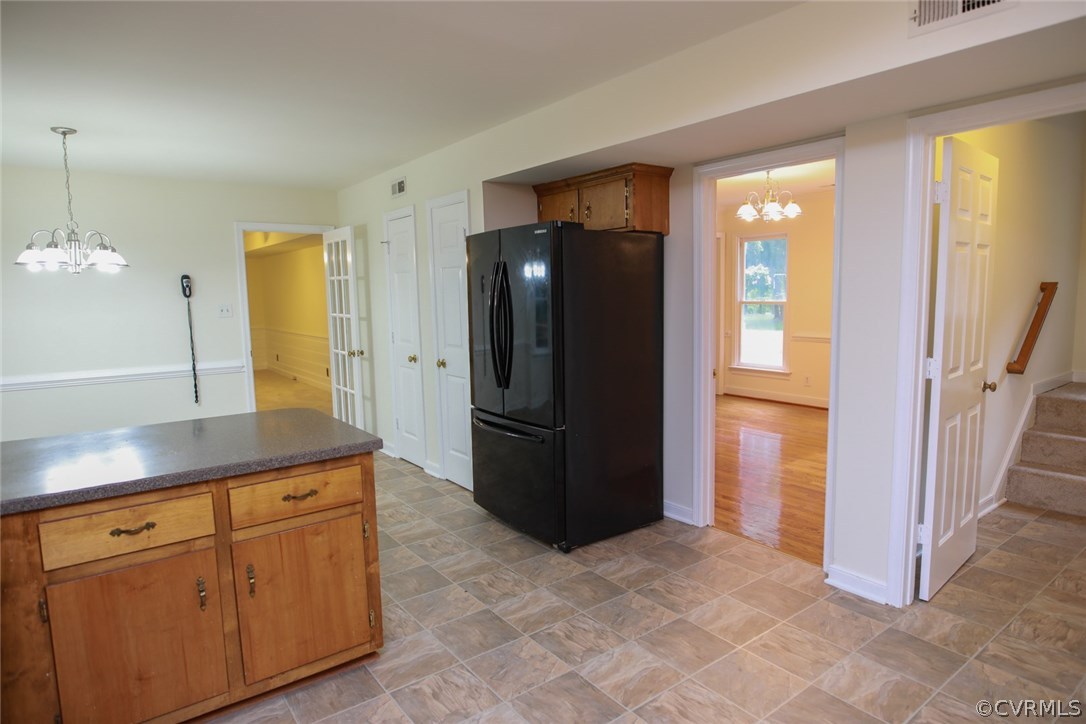 3003 Cove Ridge Road Midlothian, VA 23112 - Photo 9 of 33 a kitchen with stainless steel appliances granite countertop a refrigerator and a sink
