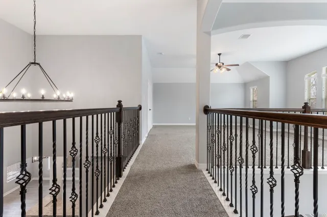 a view of a hallway view with staircase