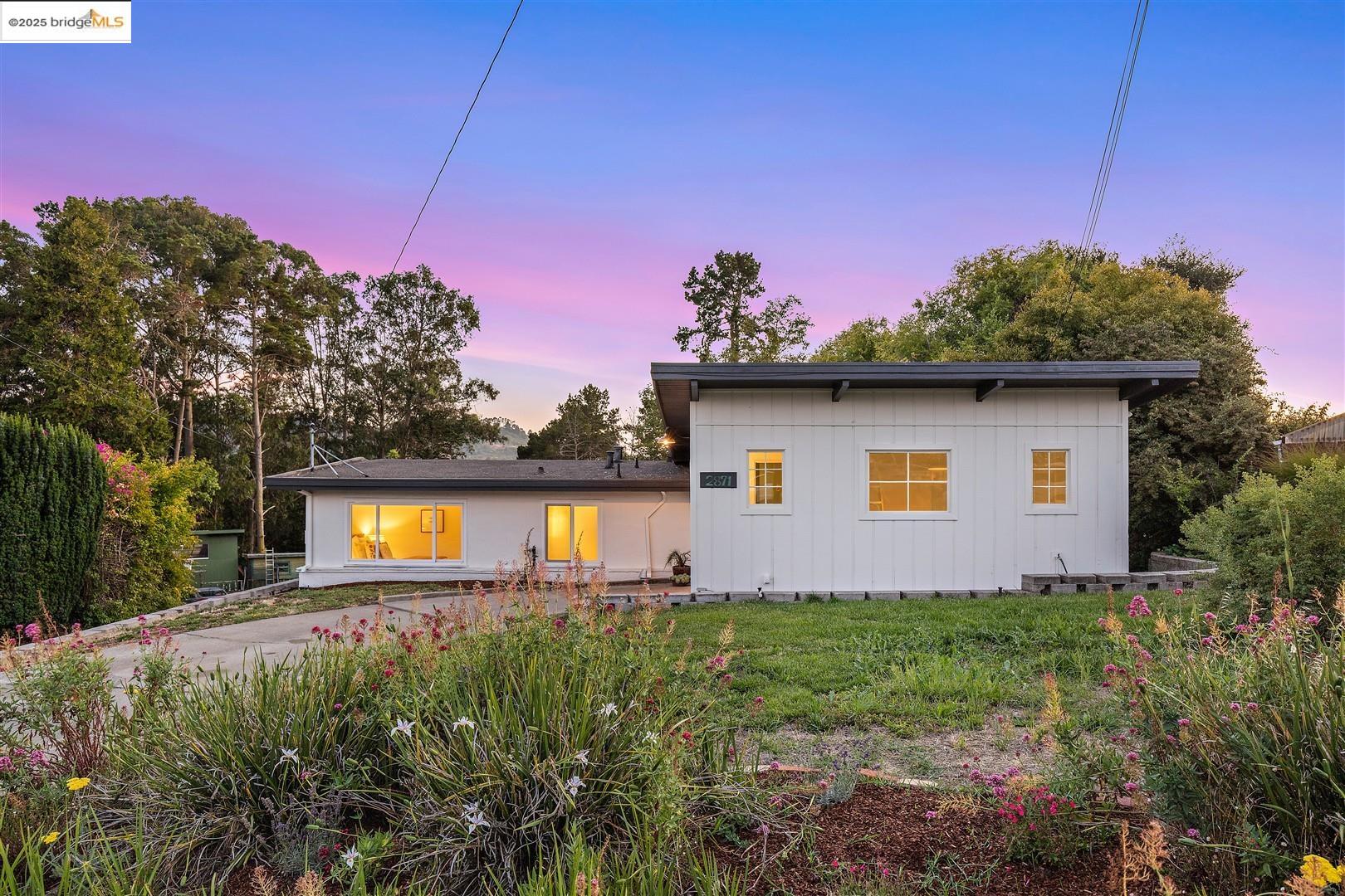 2871 Stephen Drive Richmond, CA 94803 - Photo 1 of 1 a front view of a house with garden