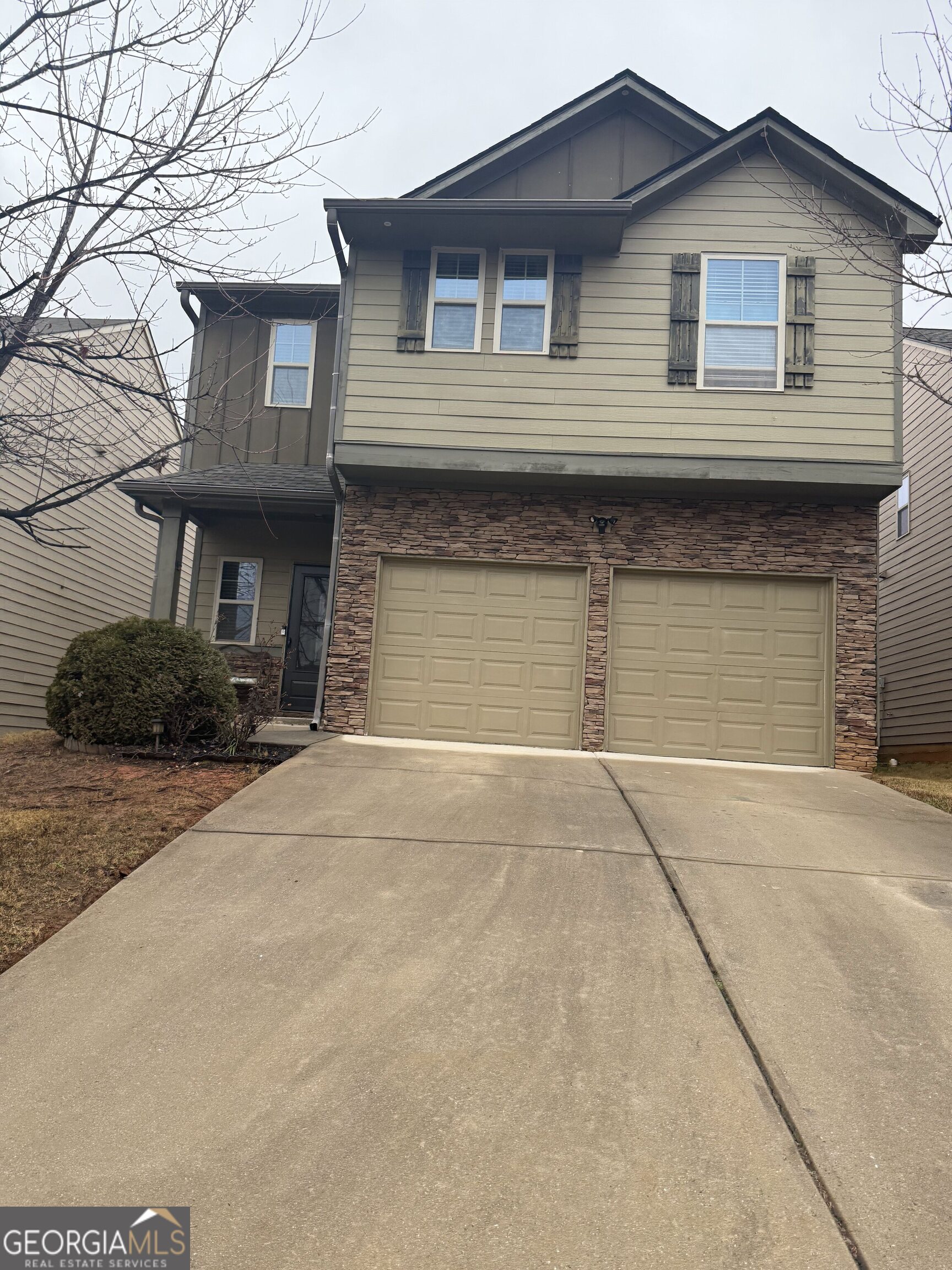 4815 Longview Run Decatur, GA 30035 - Photo 25 of 25 a front view of a house with a yard and garage