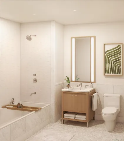 a bathroom with a sink a toilet and a bathtub