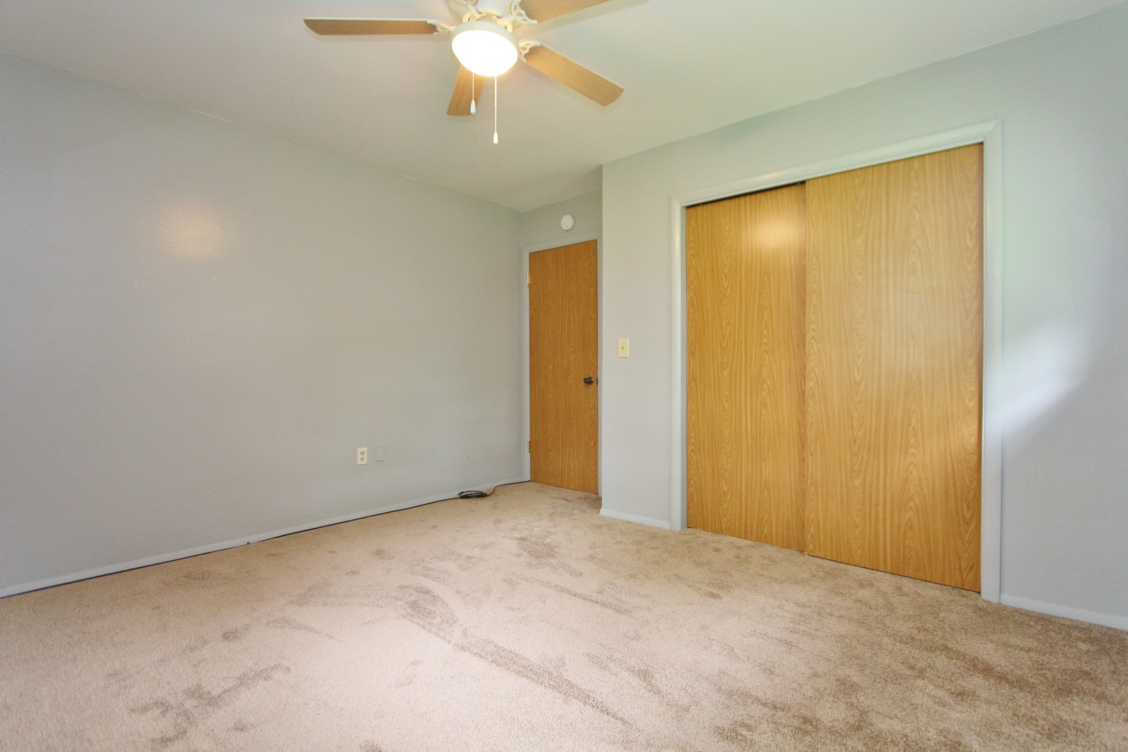 1222 Susan Circle Morris, IL 60450 - Photo 14 of 31 a view of an empty room with a chandelier fan