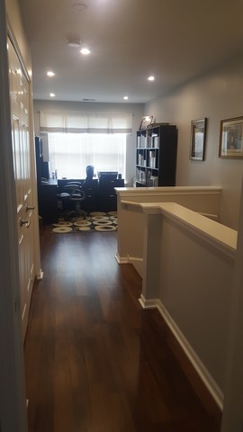 442 Holiday Lane, Unit 402 Round Lake, IL 60073 - Photo 15 of 17 a living room with furniture and a flat screen tv