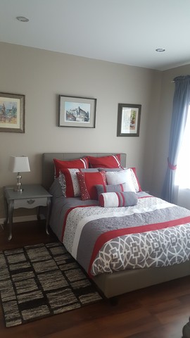 442 Holiday Lane, Unit 402 Round Lake, IL 60073 - Photo 8 of 17 a bedroom with a bed and wooden floor