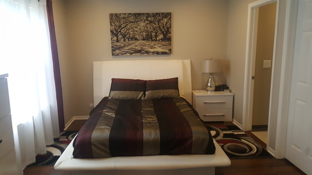 442 Holiday Lane, Unit 402 Round Lake, IL 60073 - Photo 9 of 17 a bedroom with bed and furniture