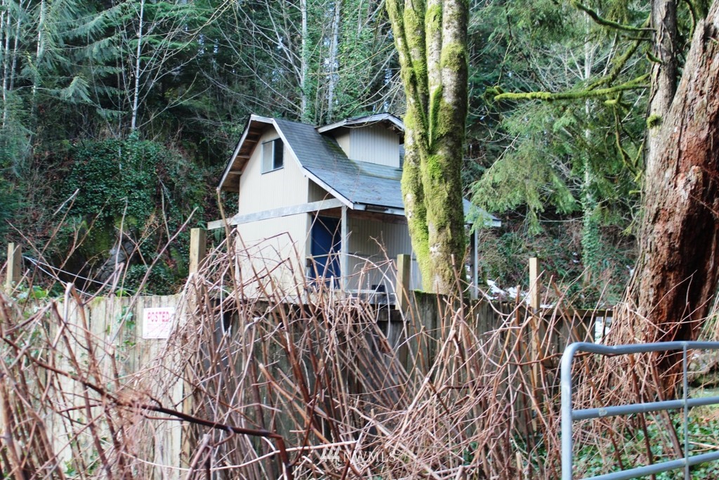 51419 North Riverside Road Gold Bar, WA 98251 - Photo 1 of 24 a view of a house with yard and sitting area