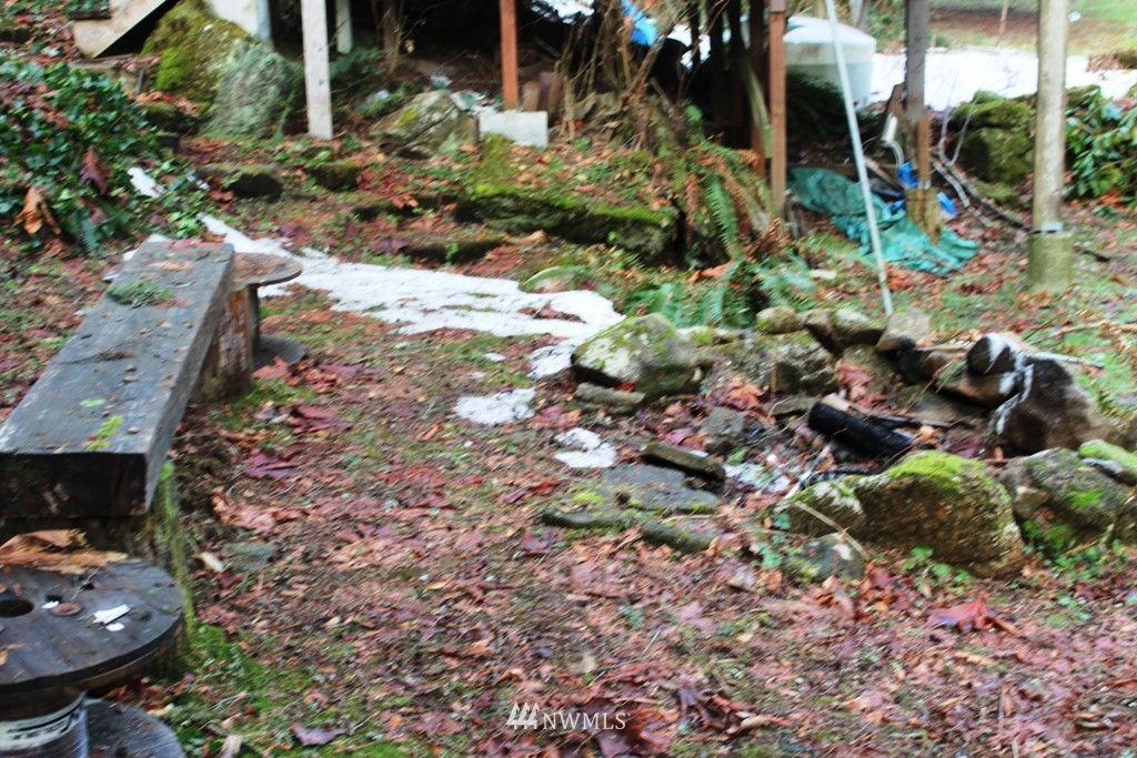 51419 North Riverside Road Gold Bar, WA 98251 - Photo 14 of 24 a backyard of a house with a yard and outdoor seating