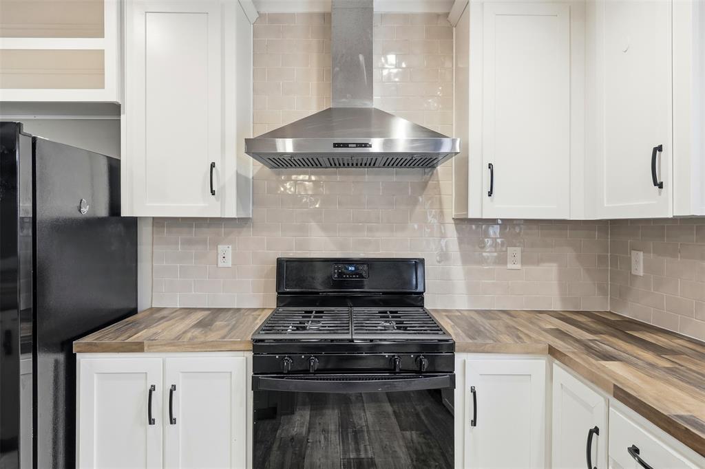 2114 Hickory Street Mabank, TX 75156 - Photo 6 of 31 Gas oven and range with stainless steel vent a hood