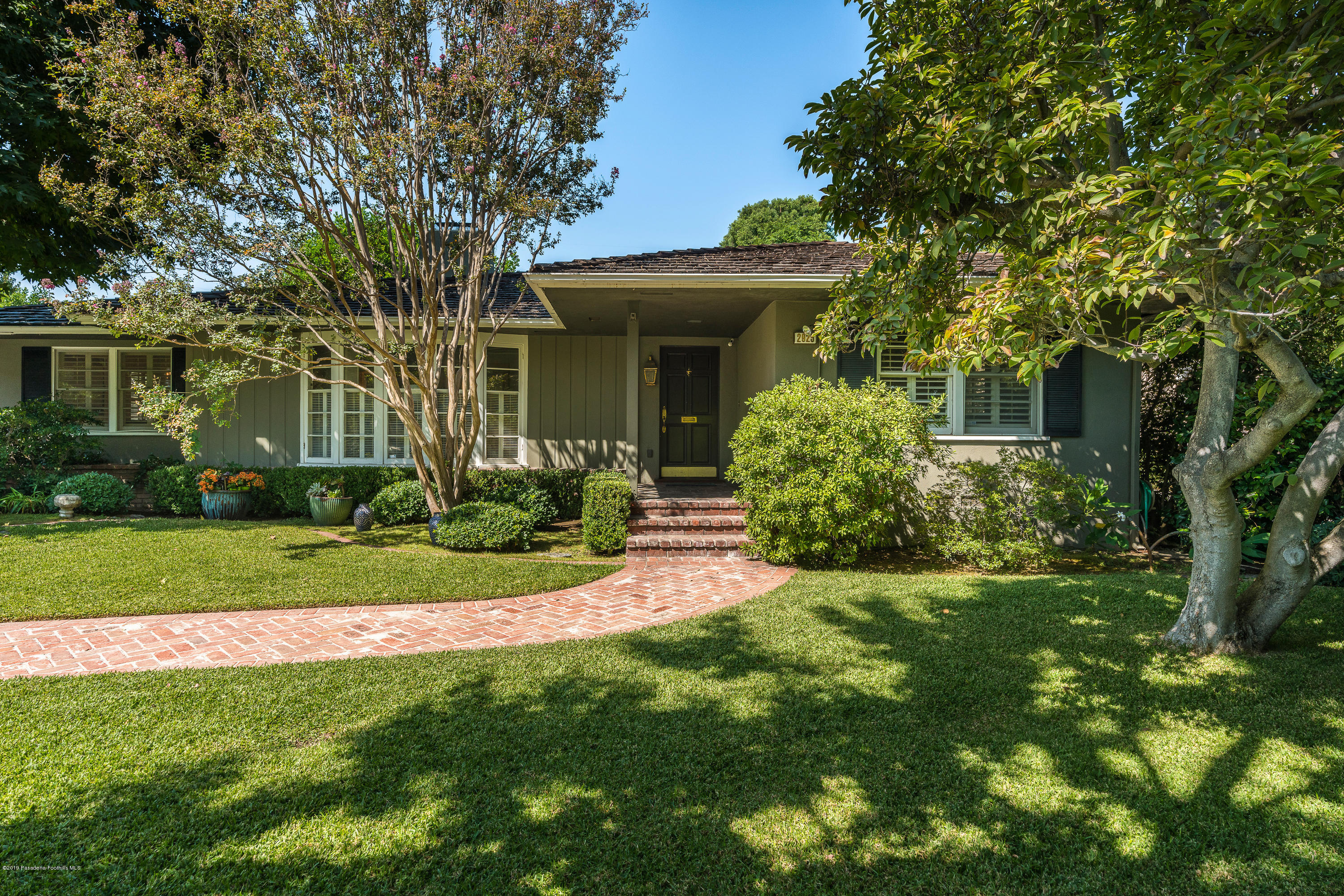 2925 Lorain Road San Marino, CA 91108 - Photo 1 of 18 a front view of a house with a yard and porch