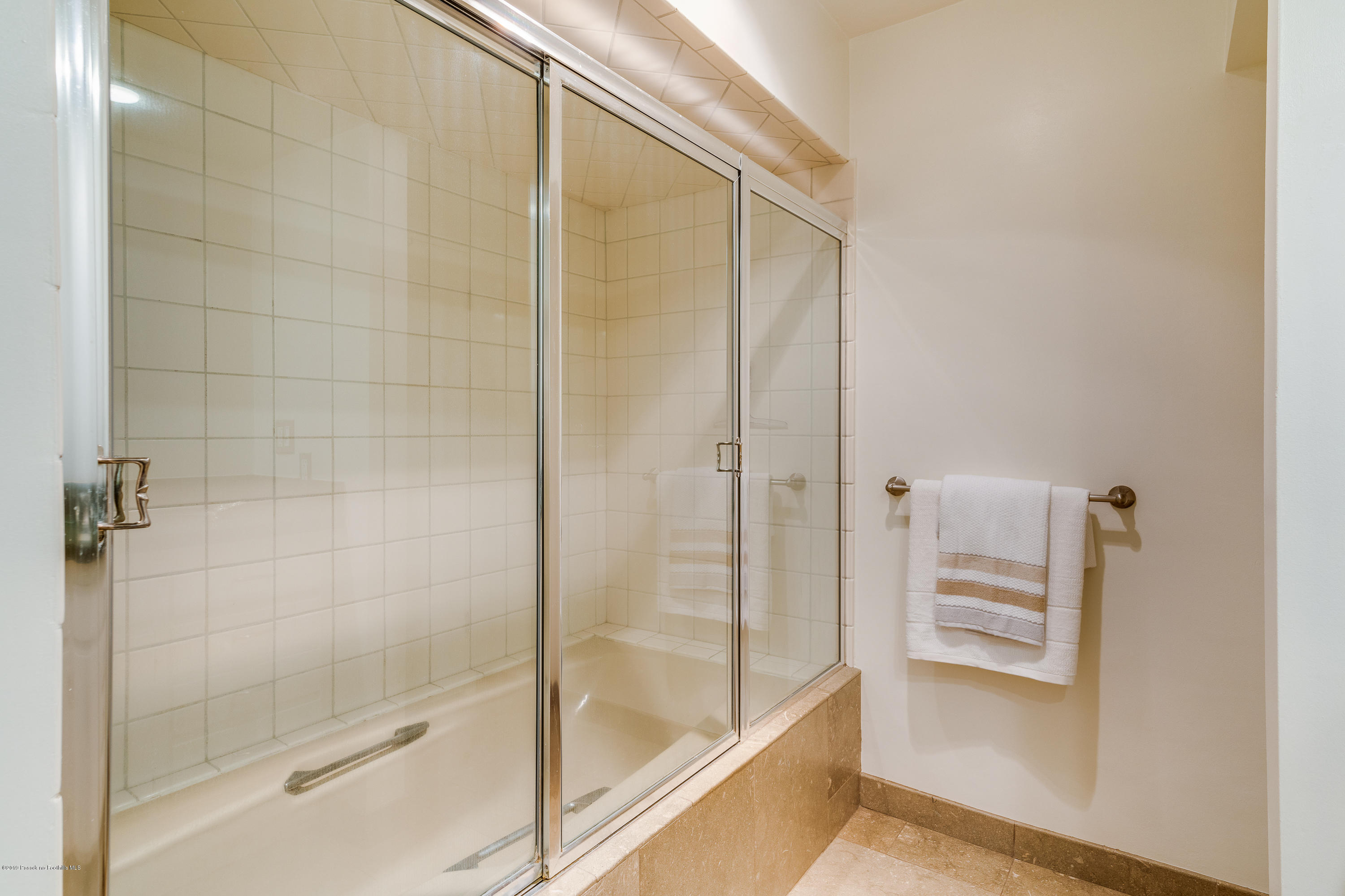 2925 Lorain Road San Marino, CA 91108 - Photo 11 of 18 a bathroom with a bathtub and a shower
