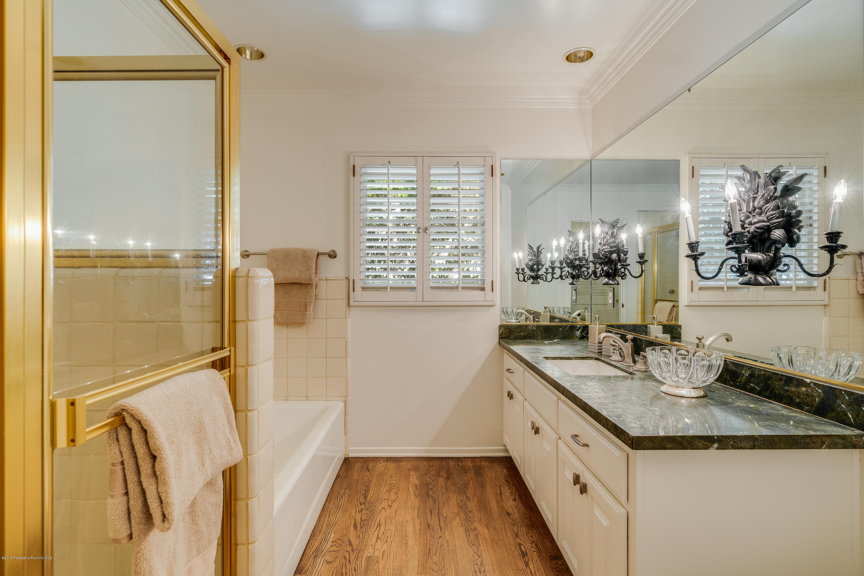2925 Lorain Road San Marino, CA 91108 - Photo 13 of 18 a bathroom with a granite countertop sink a mirror and a shower