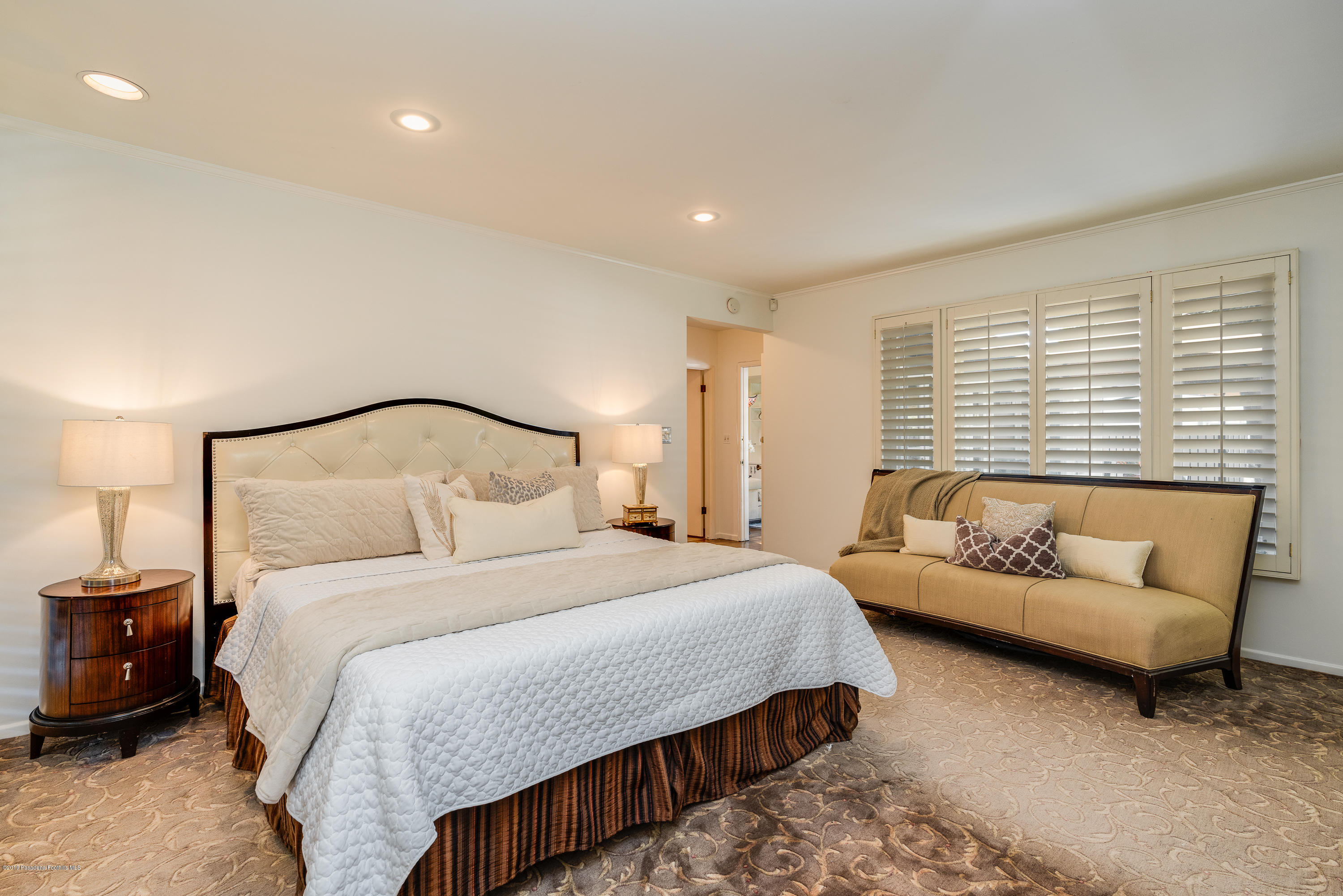 2925 Lorain Road San Marino, CA 91108 - Photo 9 of 18 a bedroom with bed and a couch
