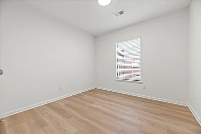a bathroom with a granite countertop toilet sink and a bathtub