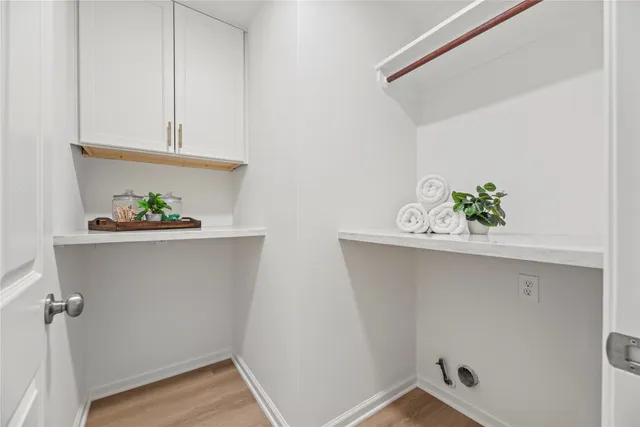 a view of a yard in front of a house with large trees