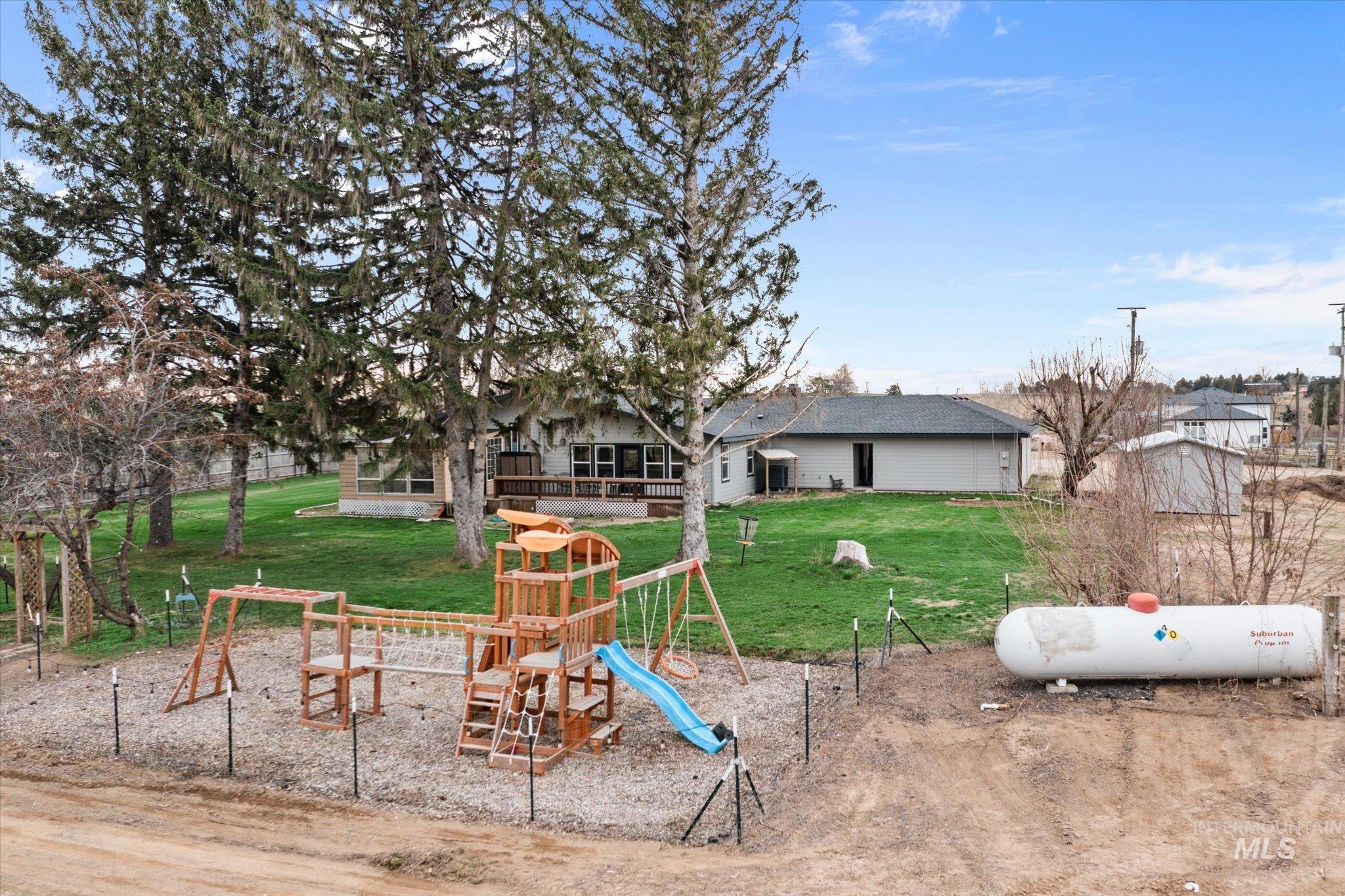 15032 Hollow Road Caldwell, ID 83607 - Photo 15 of 50 View of playground featuring a yard