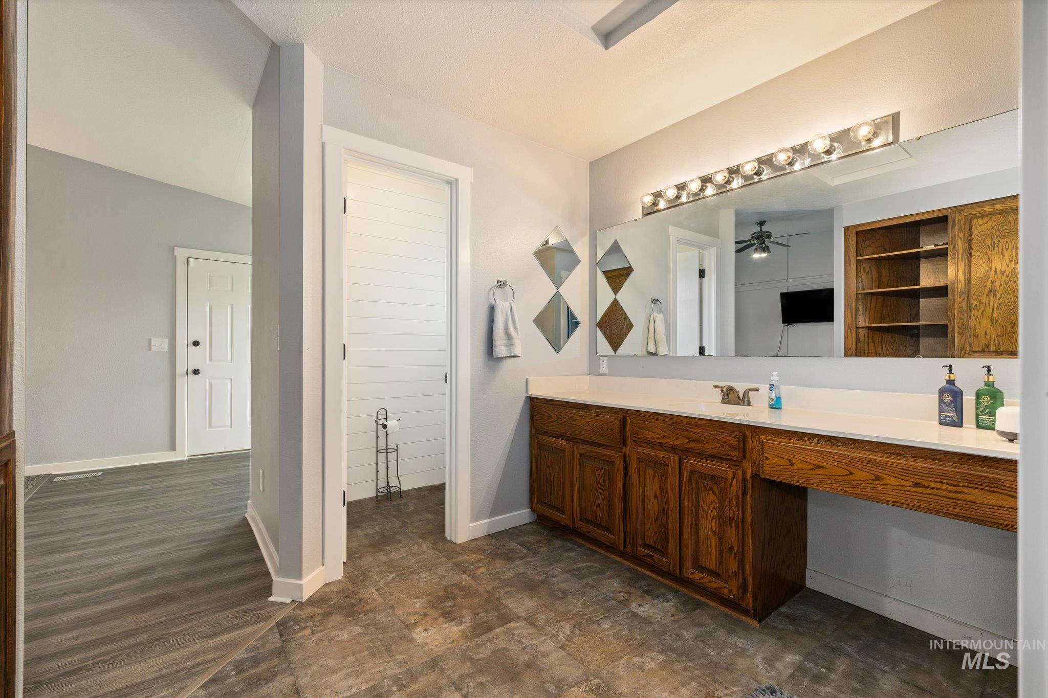 15032 Hollow Road Caldwell, ID 83607 - Photo 28 of 50 Full bathroom with vanity and baseboards
