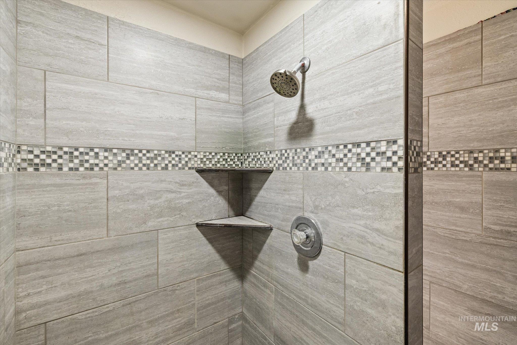 15032 Hollow Road Caldwell, ID 83607 - Photo 29 of 50 Bathroom view of a tile shower