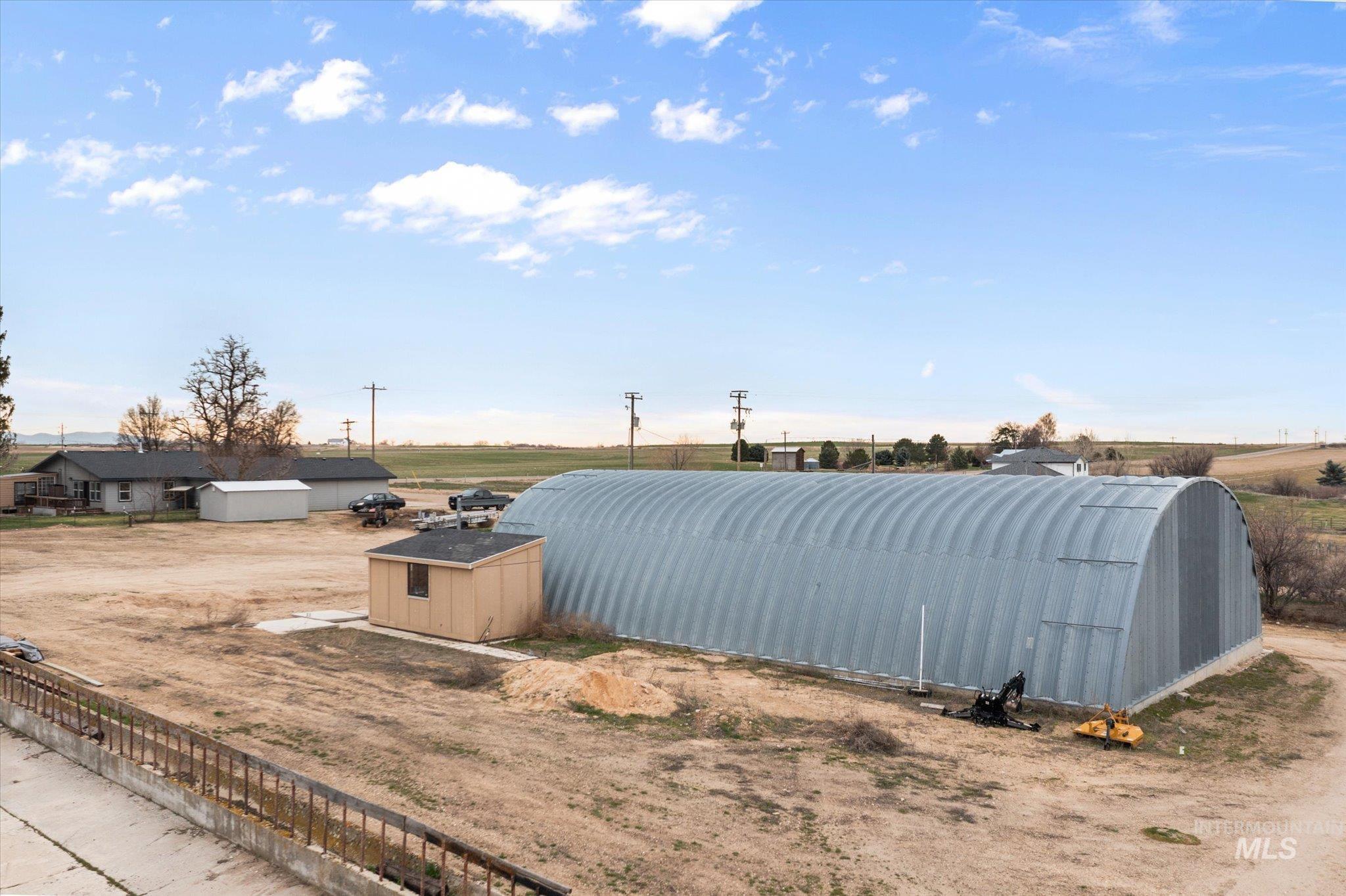 15032 Hollow Road Caldwell, ID 83607 - Photo 3 of 50 View of yard with an outbuilding and a shed