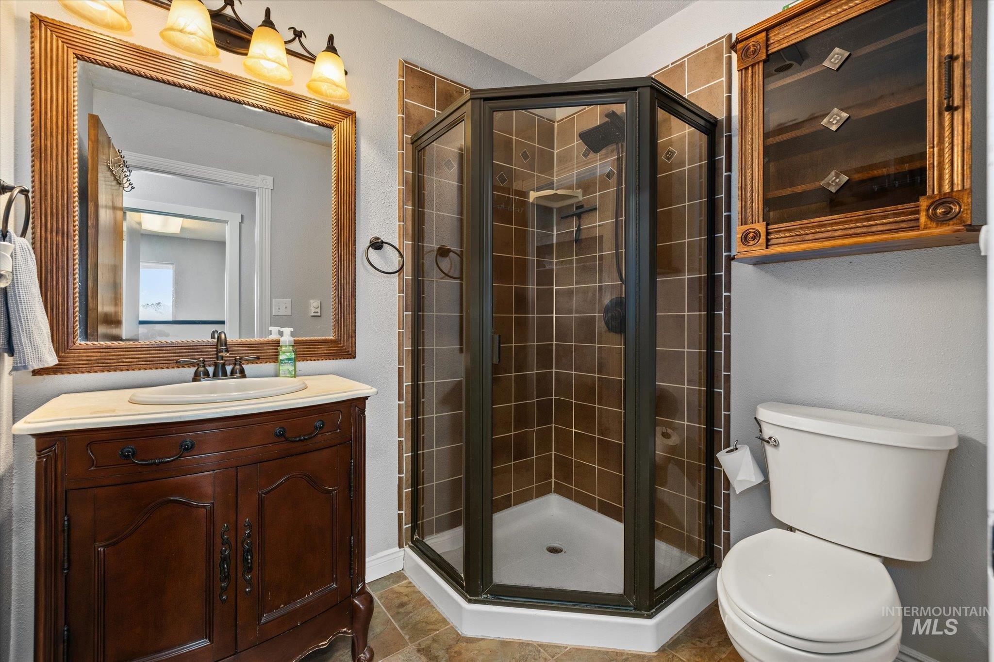 15032 Hollow Road Caldwell, ID 83607 - Photo 34 of 50 Bathroom featuring a stall shower and vanity