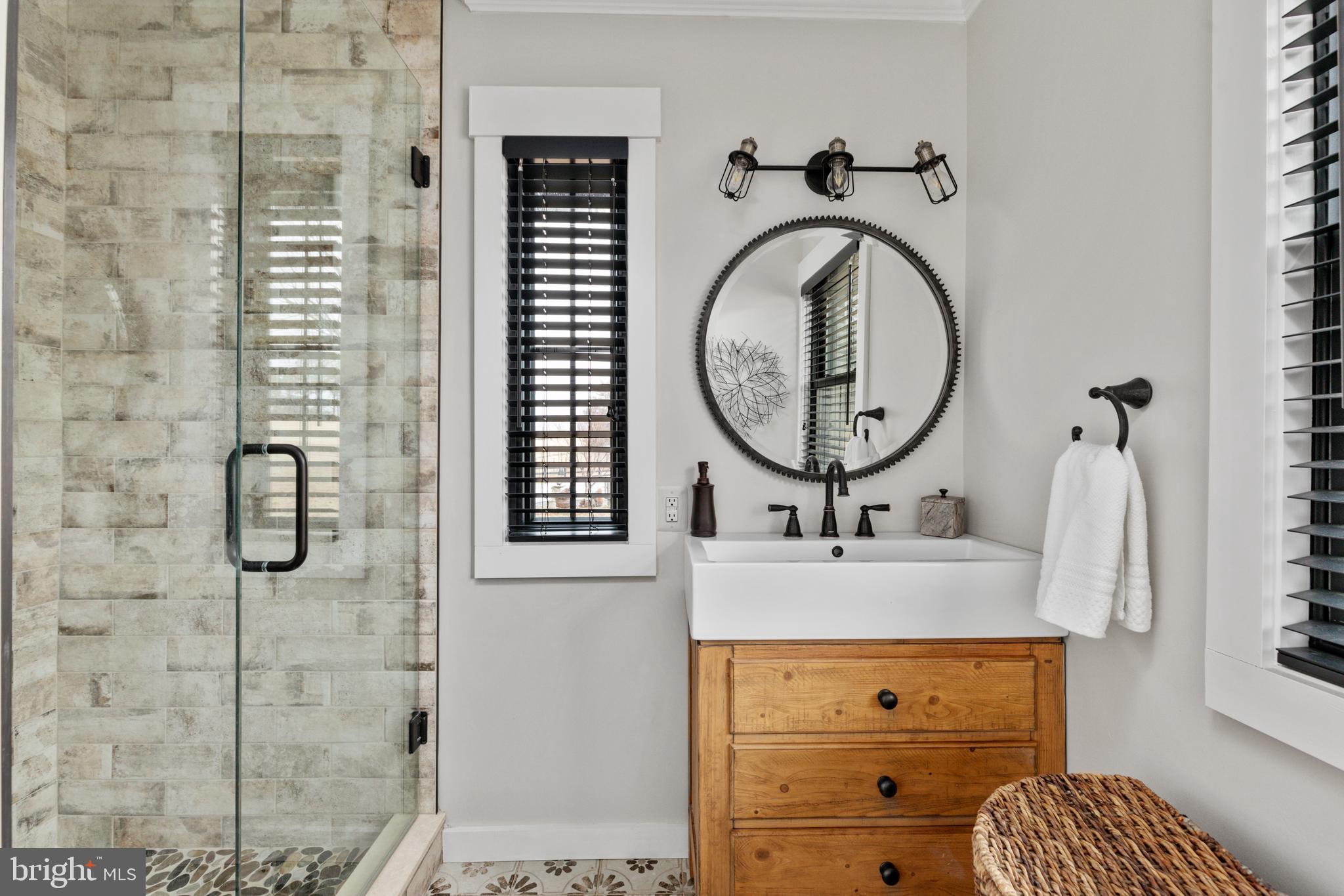 7464 Wilson Road Warrenton, VA 20186 - Photo 13 of 22 a bathroom with a sink mirror and vanity