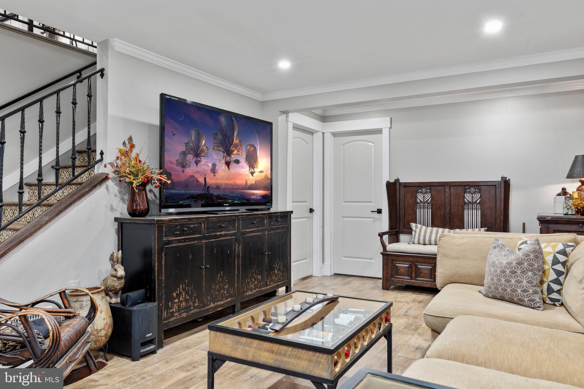 7464 Wilson Road Warrenton, VA 20186 - Photo 16 of 22 a living room with furniture a fireplace and a flat screen tv