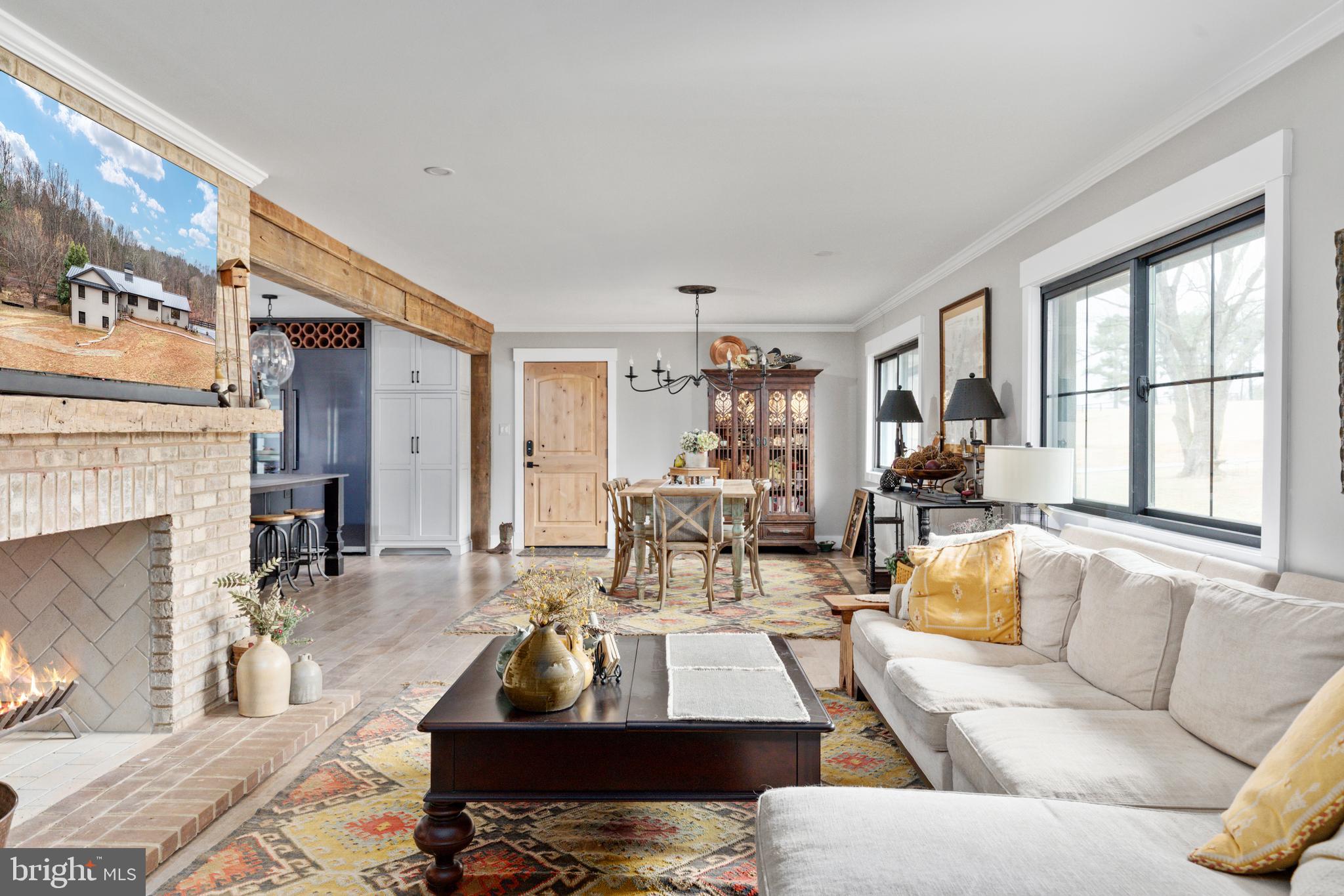 7464 Wilson Road Warrenton, VA 20186 - Photo 5 of 22 a living room with furniture fireplace and a large window