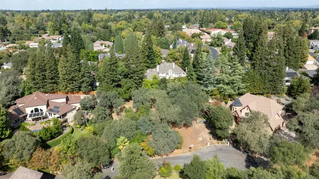 an aerial view of residential house with parking space