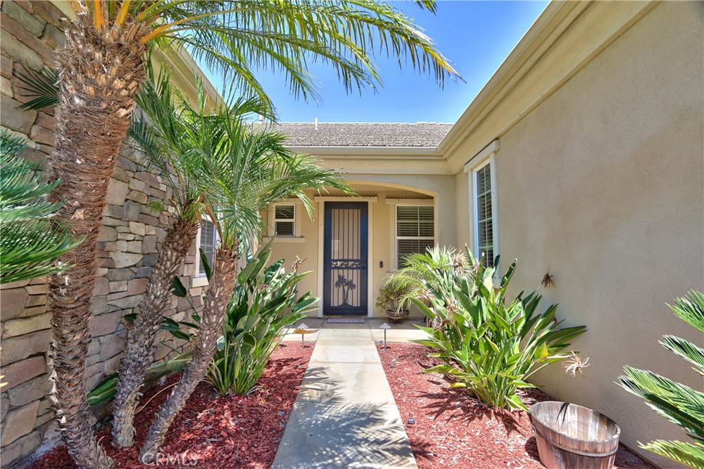 28483 Nautical Point Circle Menifee, CA 92585 - Photo 2 of 44 a entryway with flower plants