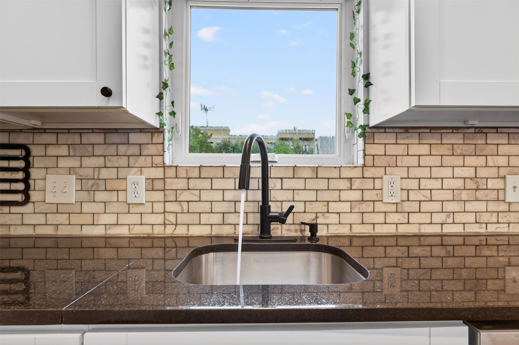 2716 Bagby Street Houston, TX 77006 - Photo 11 of 29 a bathroom with a sink and a mirror