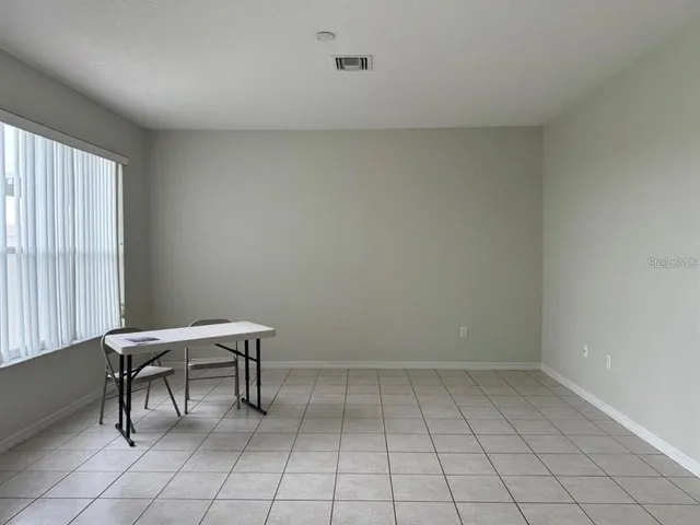 a view of a room with windows