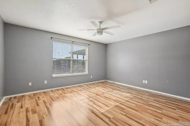 a view of a room with wooden floor