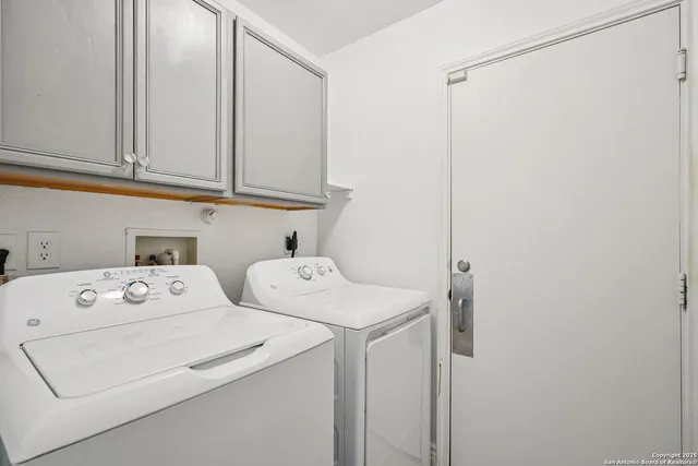 a view of a house with a tree in the background