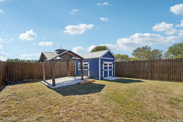 an aerial view of residential building with an outdoor space
