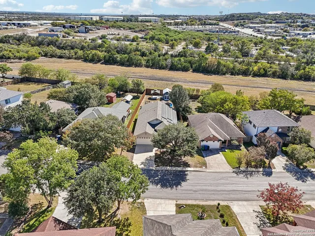 an aerial view of a house with outdoor space