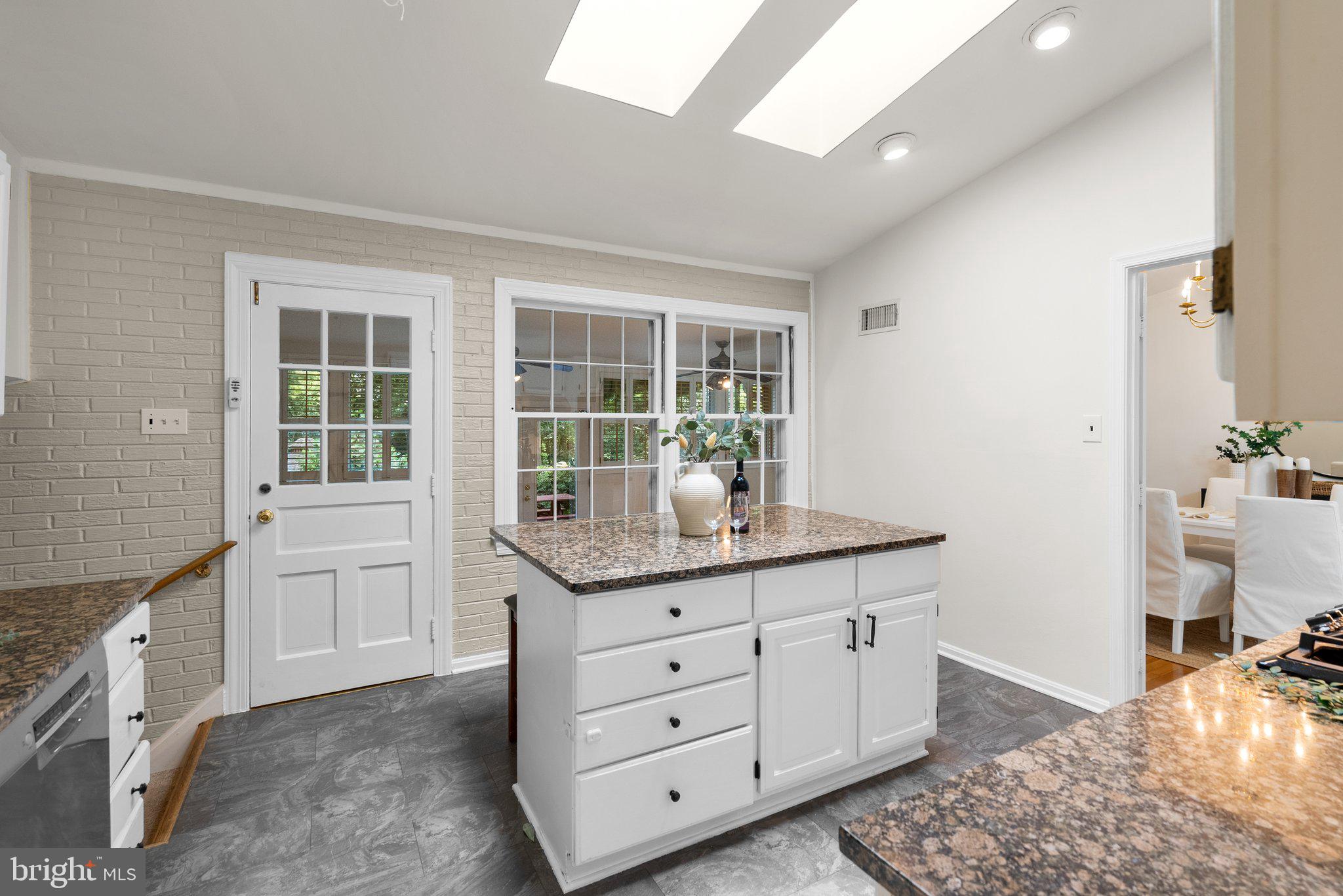 200 Eldrid Drive Silver Spring, MD 20904 - Photo 13 of 44 a kitchen with granite countertop a sink cabinets and wooden floor